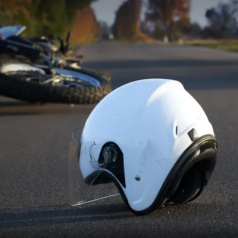 Motorcycle helmet lying on the road after a crash