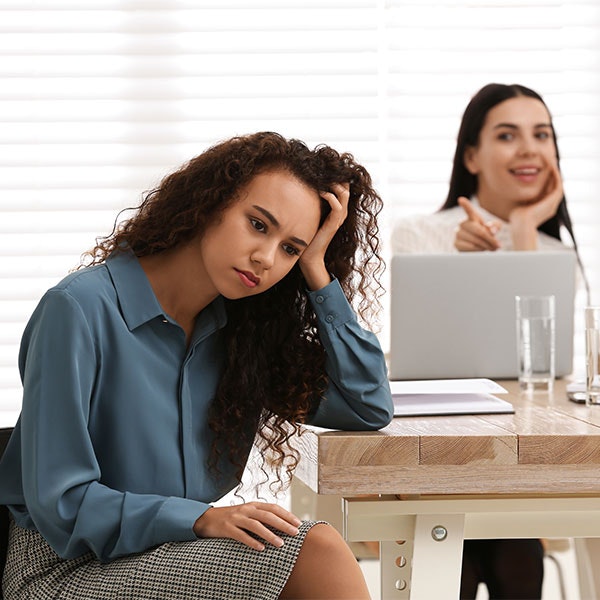 Woman receiving disparate treatment from coworker