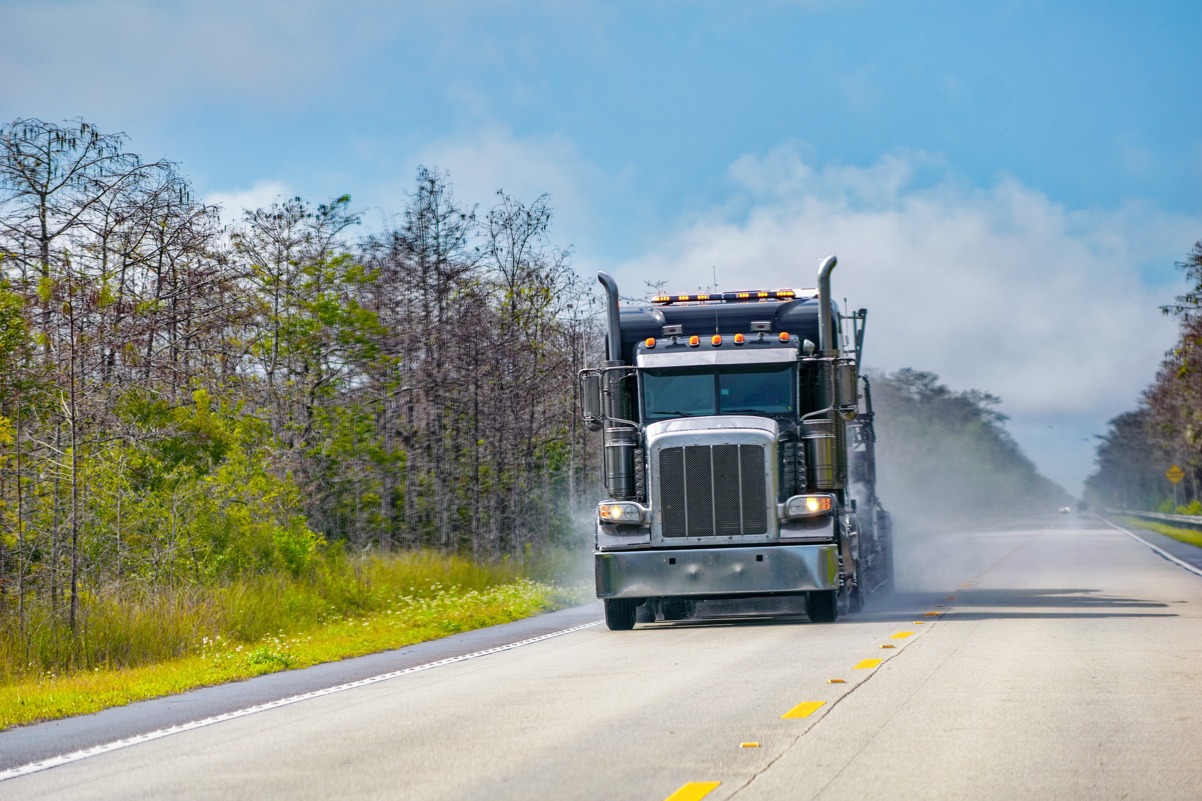 truck driving along a road in florida