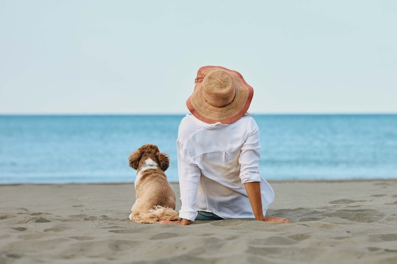 Woman and dog at the beach