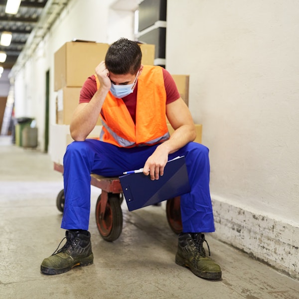 Man exhausted at work