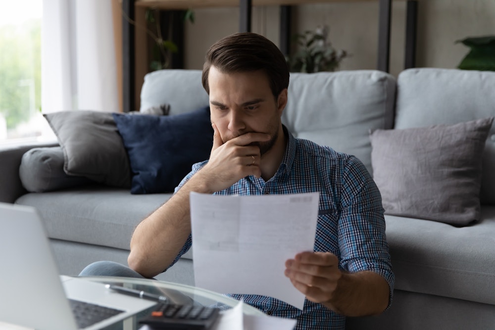 Man looking concerned over finances