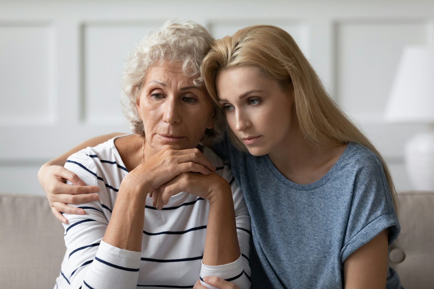 grandmother and granddaughter grieving