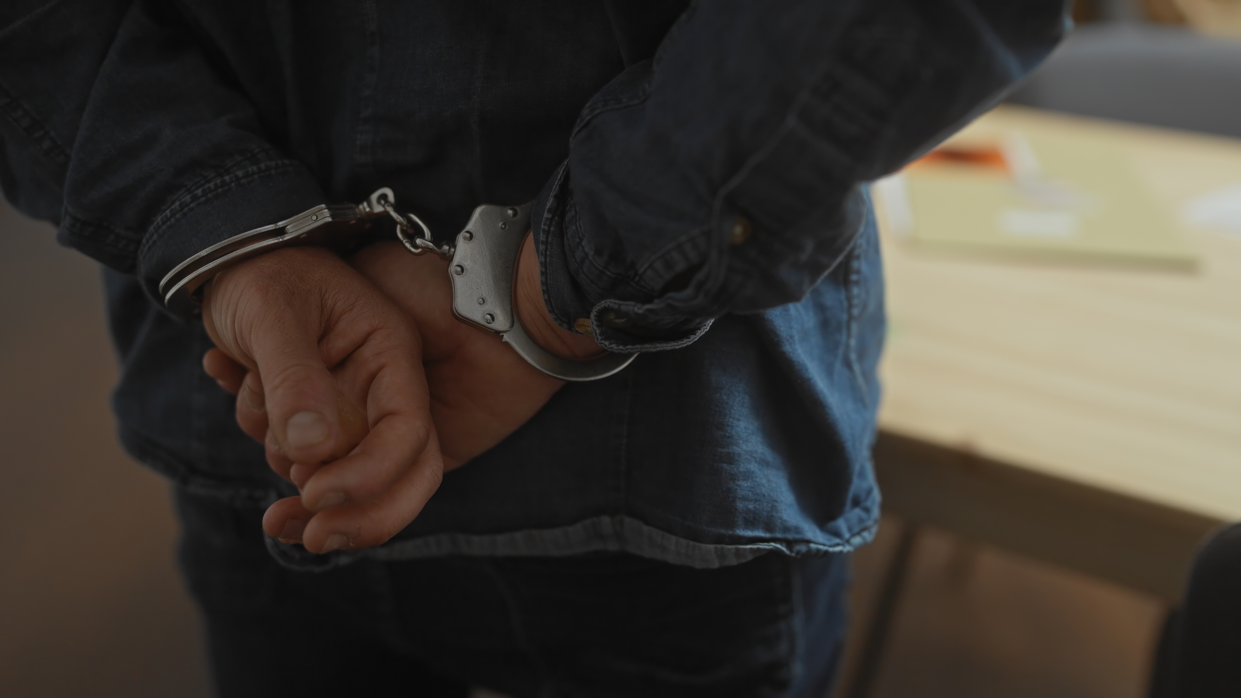 Close-up of man in handcuffs