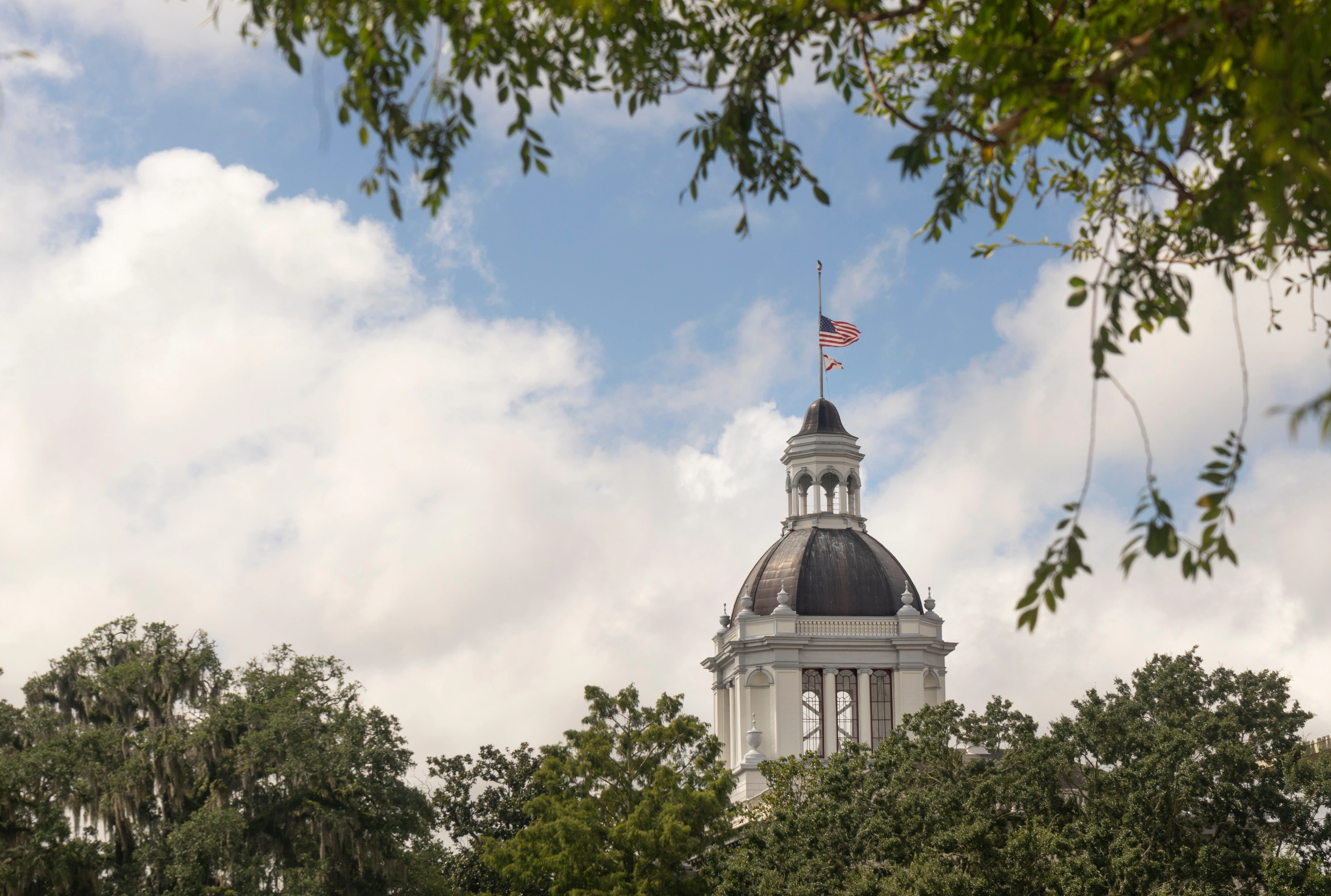 Florida State Capitol dome in Tallahassee with American and state flags