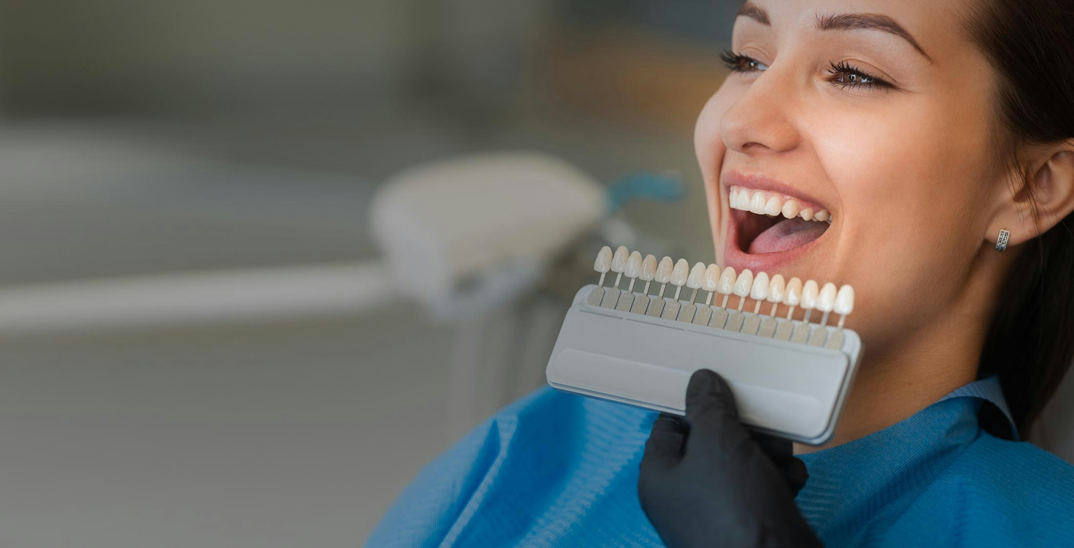 Woman looking at porcelain veneer options