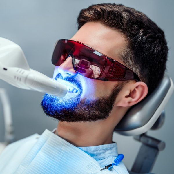 Man getting teeth whitened with Zoom