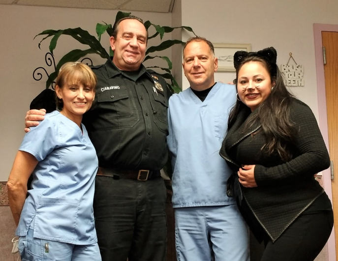 Dr. Louis J. Buono and staff with a patient