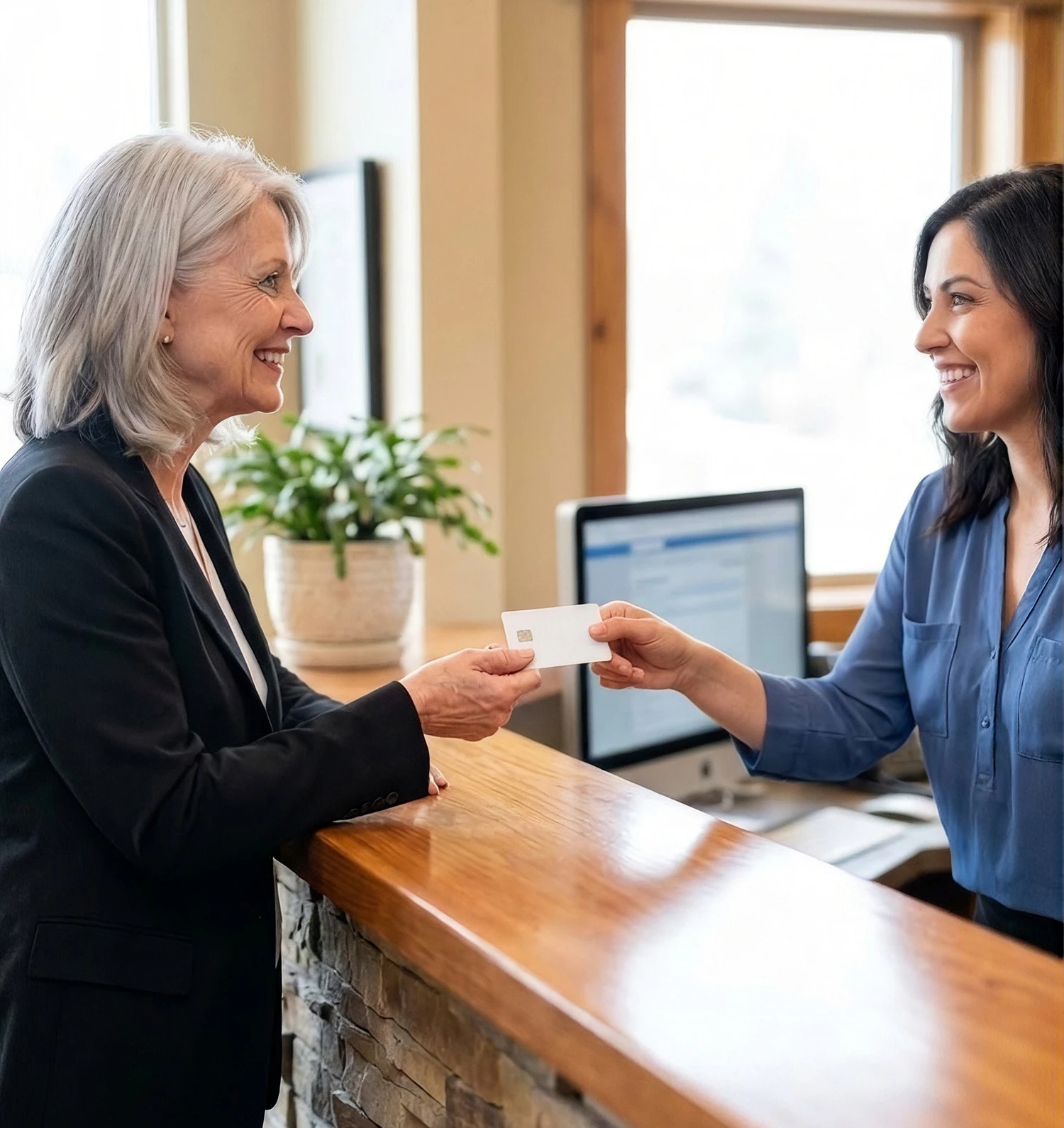 Woman holding credit card making a payment