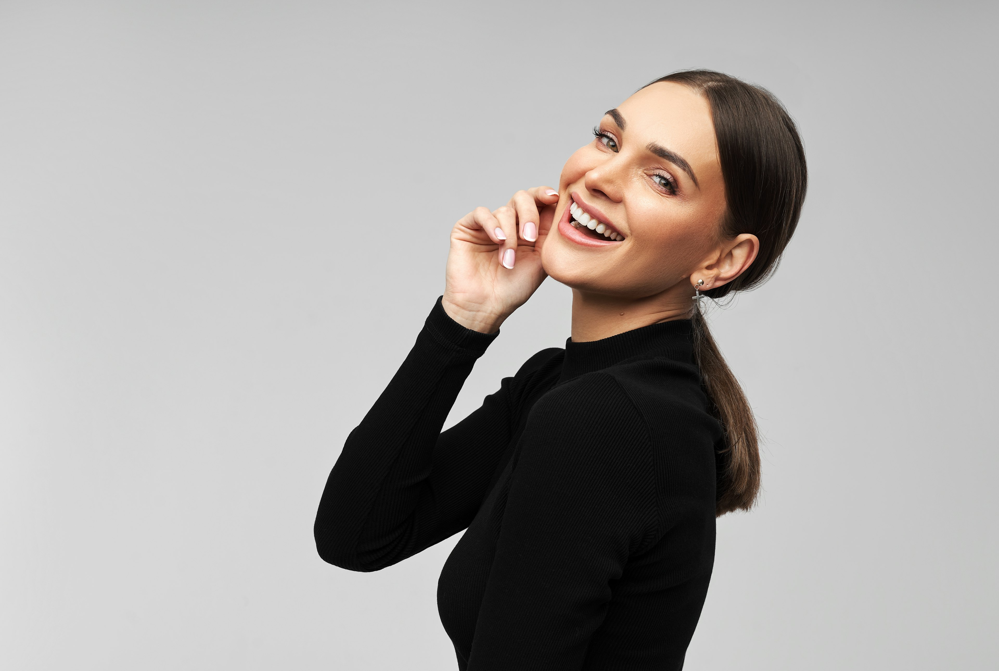 Close up of woman holding Invisalign