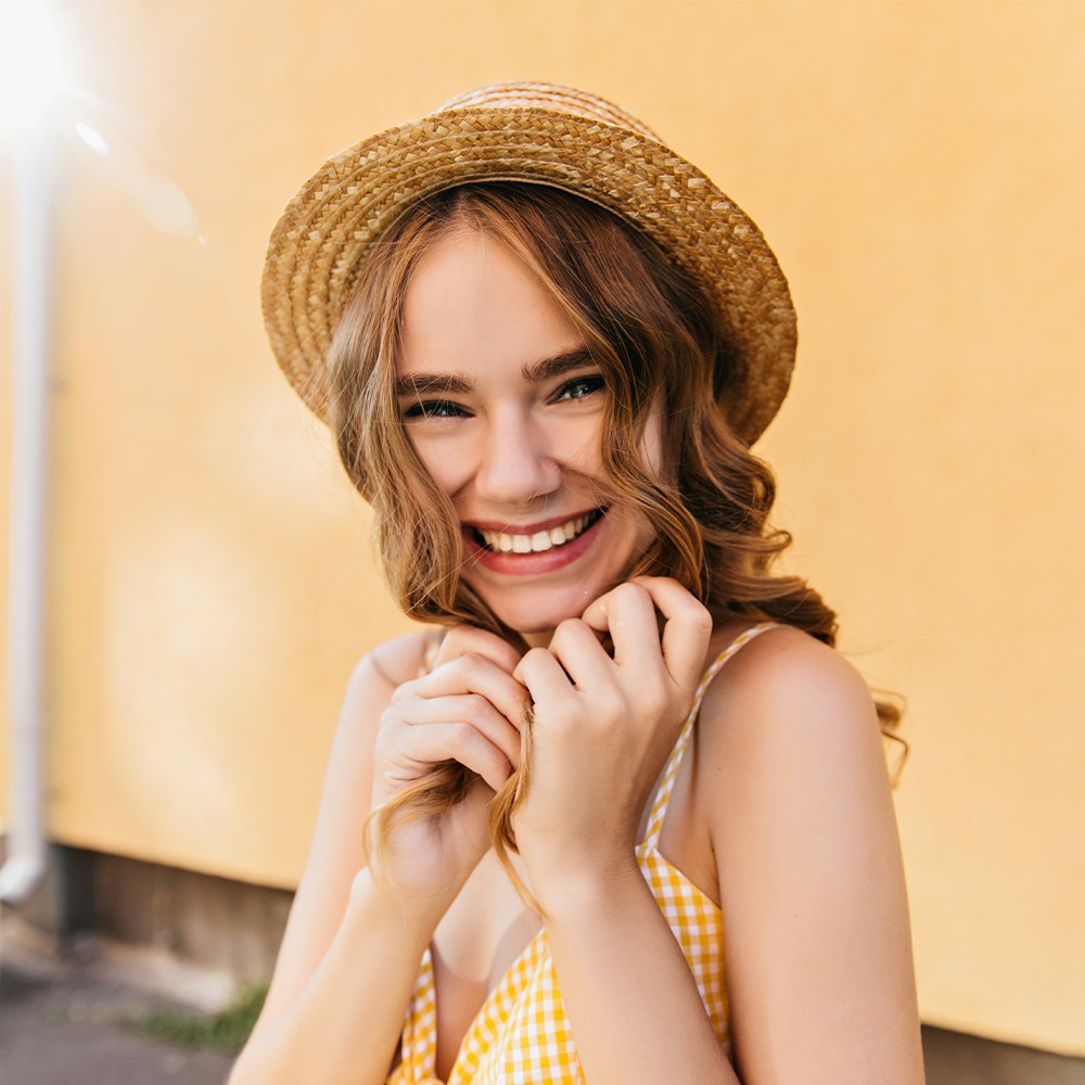 smiling woman in straw hat