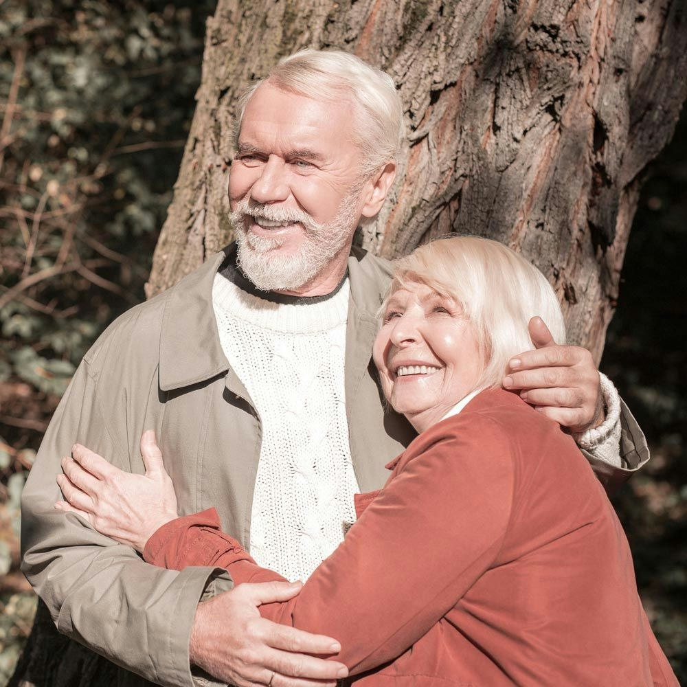 Couple hugging outdoors