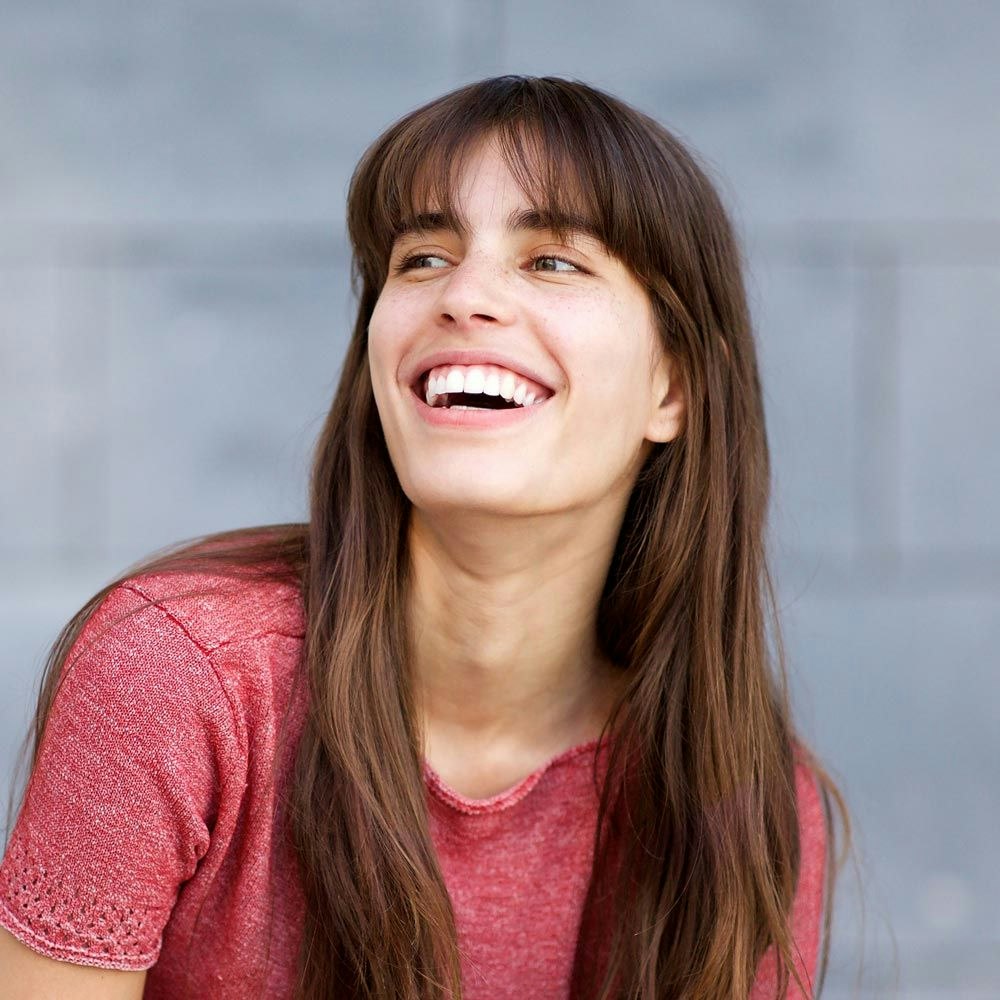 Young woman smiling brightly