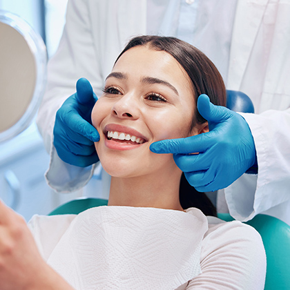Smiling patient after lip repositioning