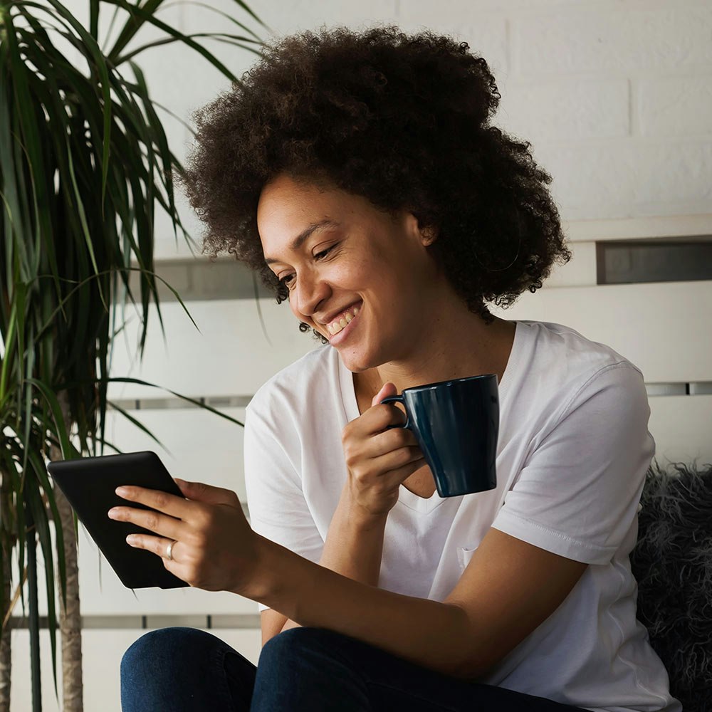 Woman reading at home after comprehensive vision care