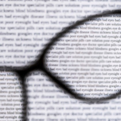 Blurry page through and outside of glasses lenses