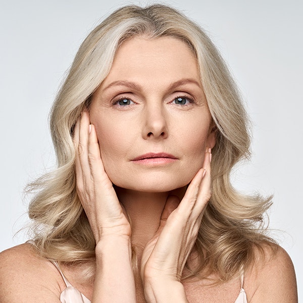 Woman with tightened skin after a deep place facelift