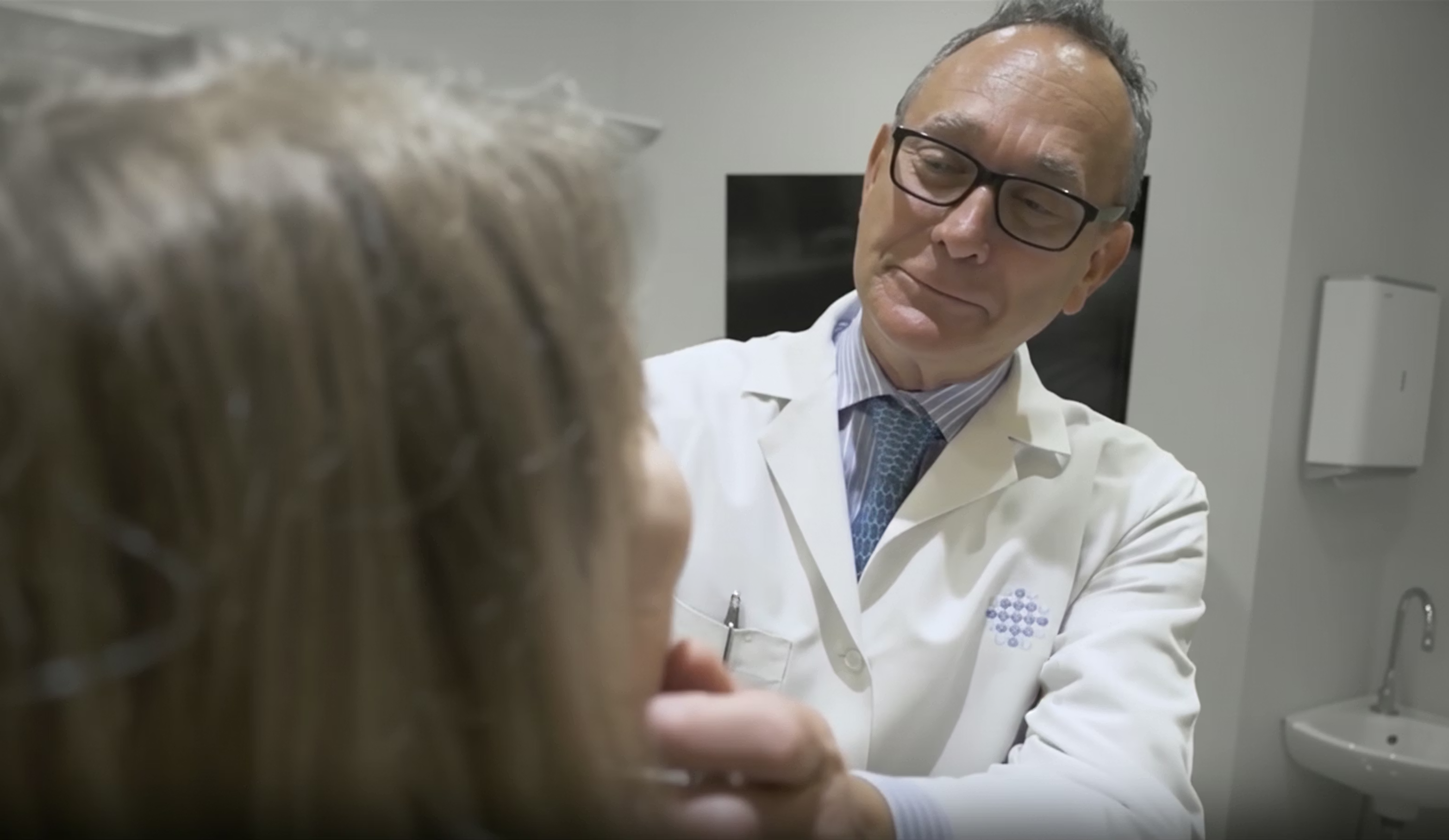 Dr. Sherris evaluating a patient