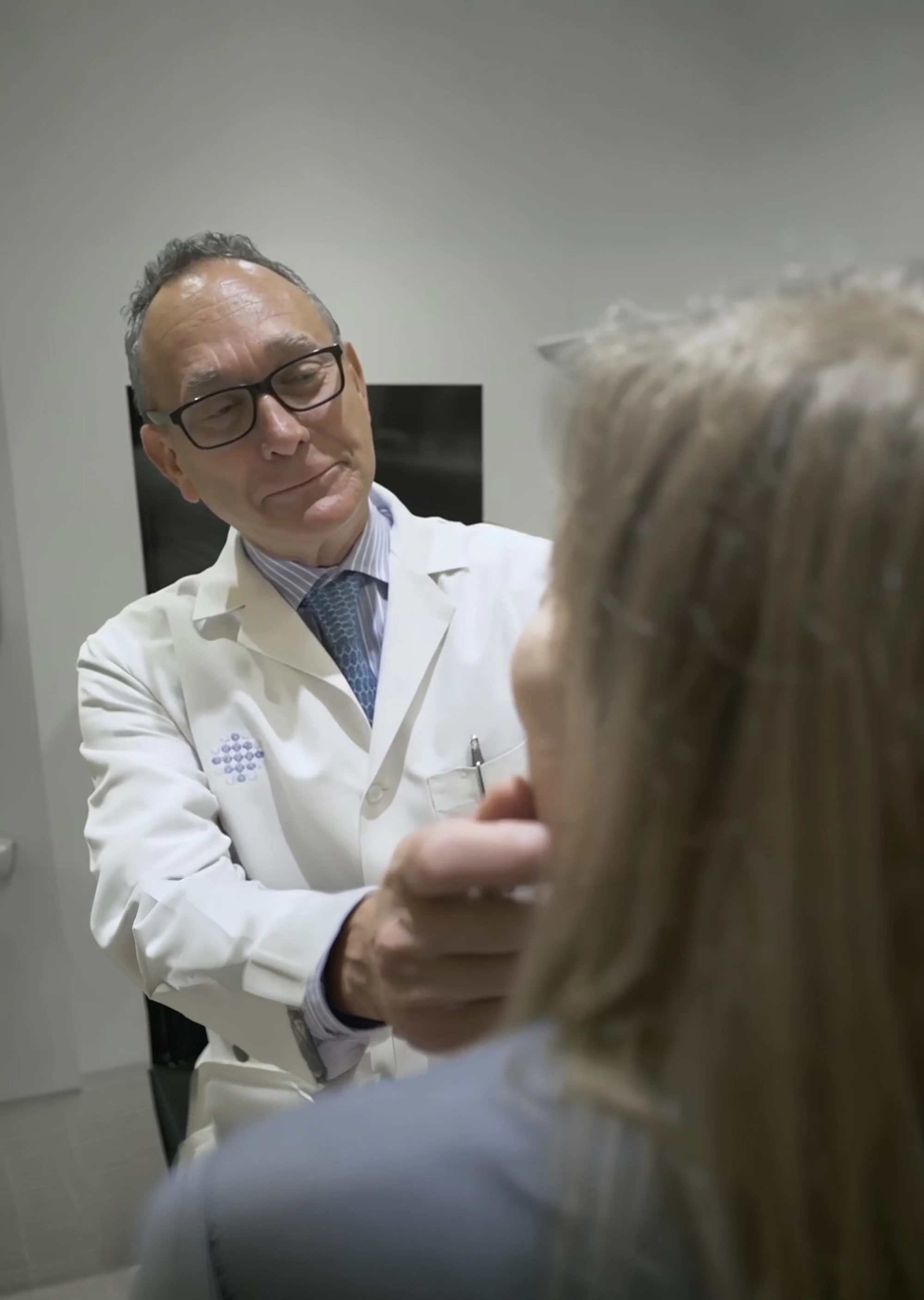 Dr. Sherris evaluating a patient