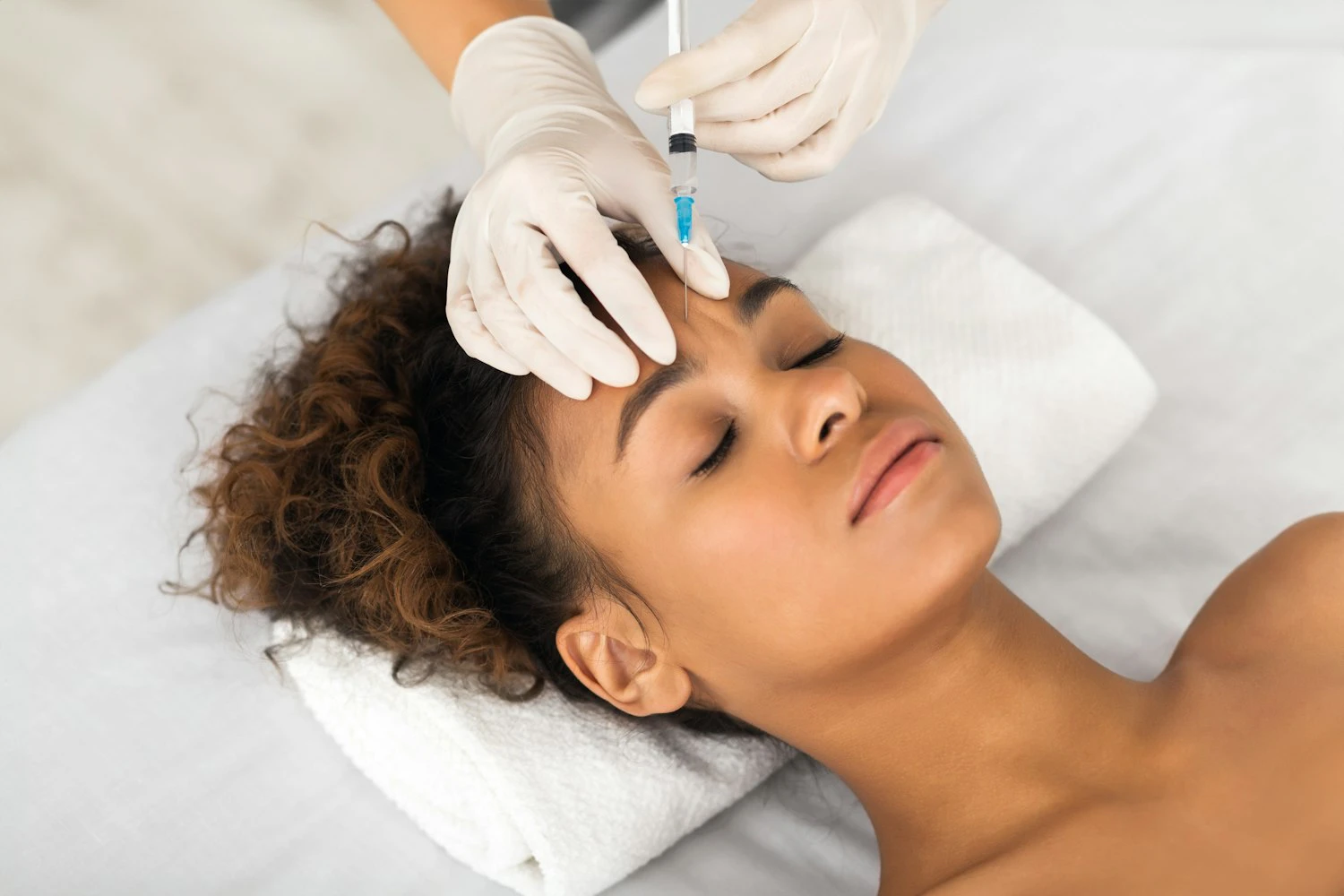 Woman receiving an injectable treatment
