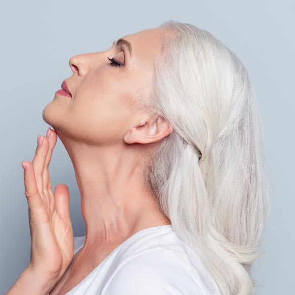 Woman touching face to feel contours