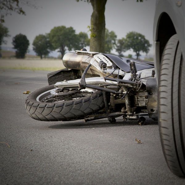 Motorcycle in front of car