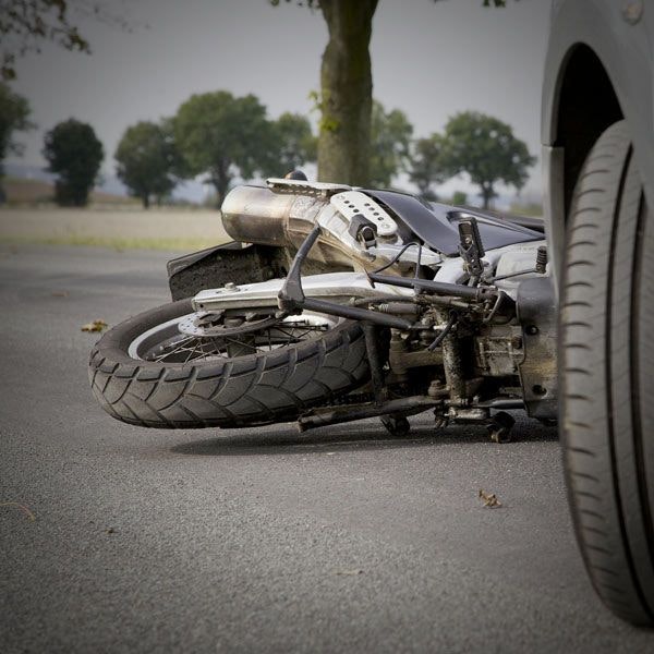 Motorcycle in front of car