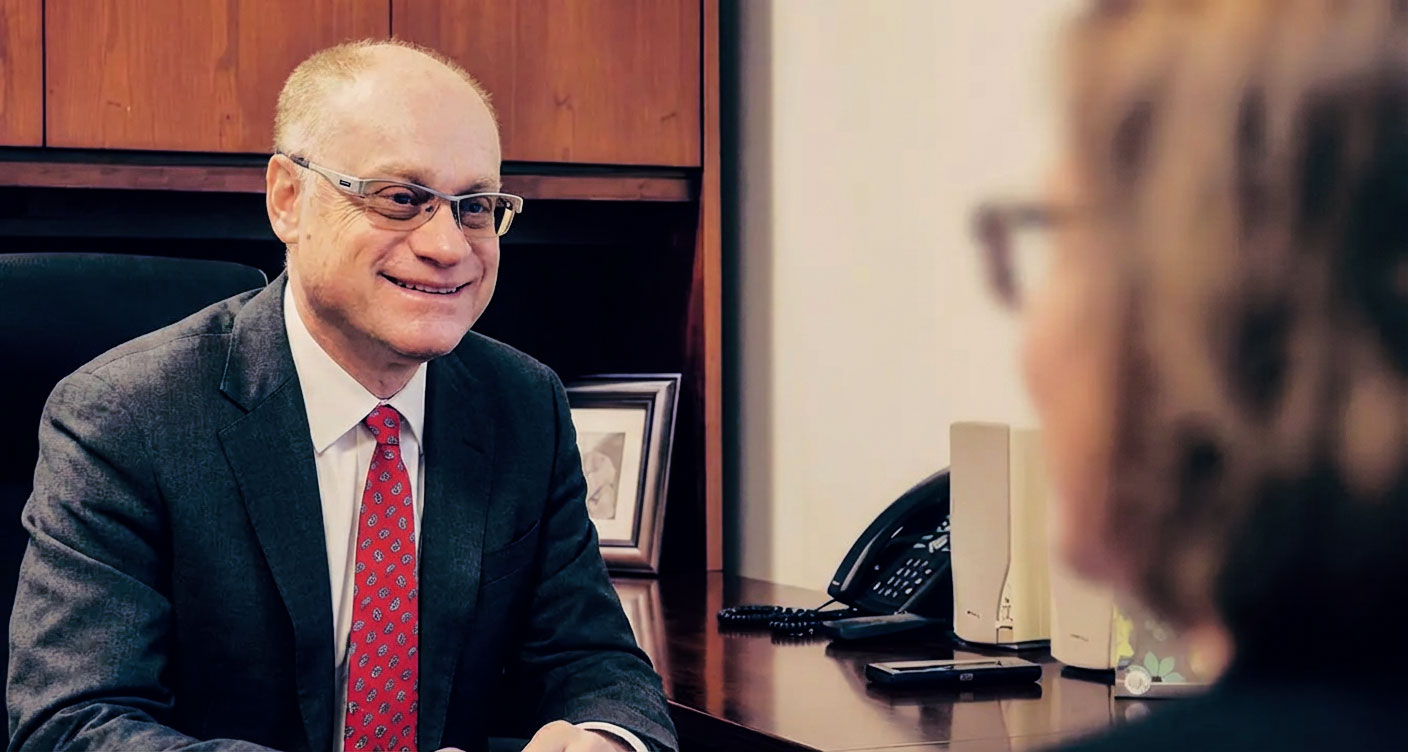 Josh Silverman talking to client