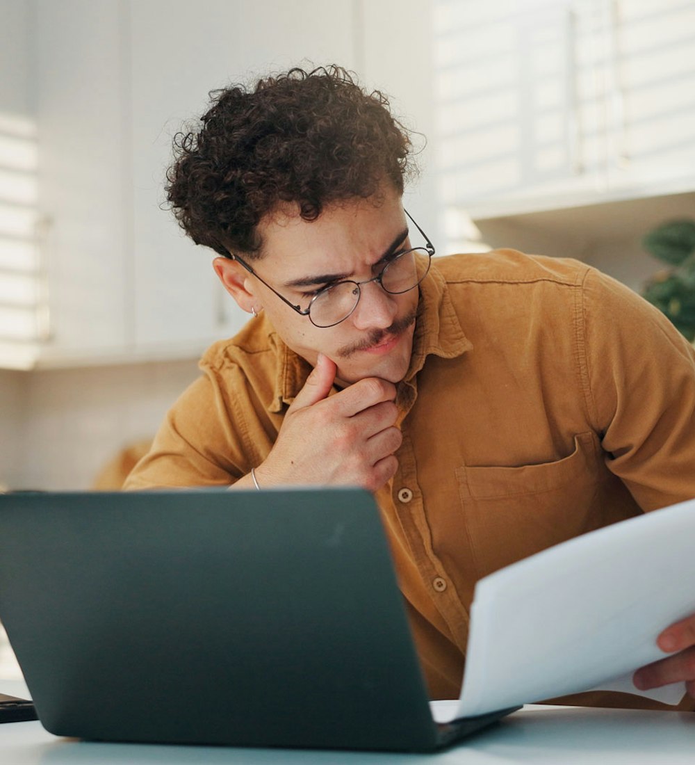 Man looking at paper 