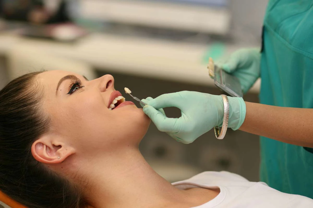 young woman receiving dental crown