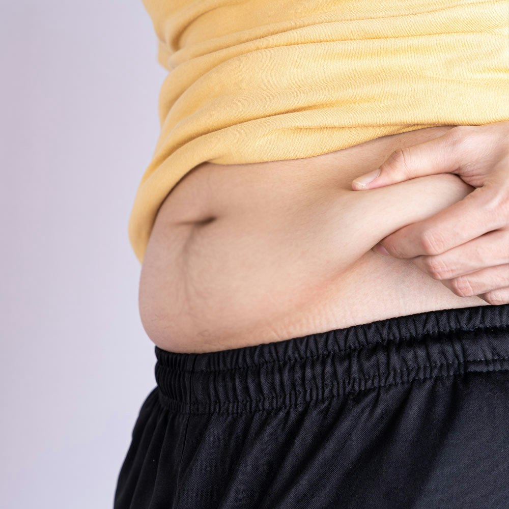 Man holding belly fat