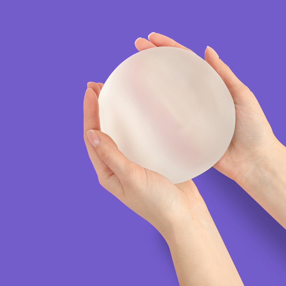 hand holding silicone Implant