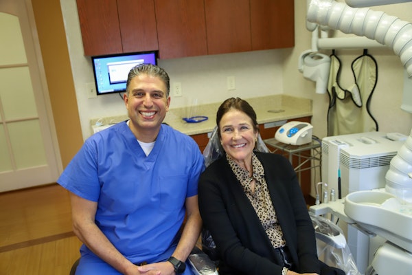 Dr. Malki with a smiling patient