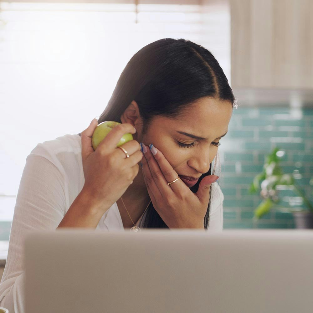 Woman with a sore tooth