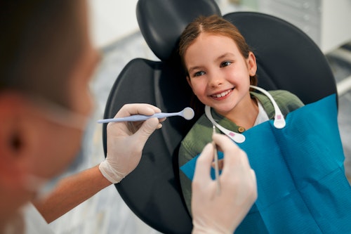 Child receiving dental treatment