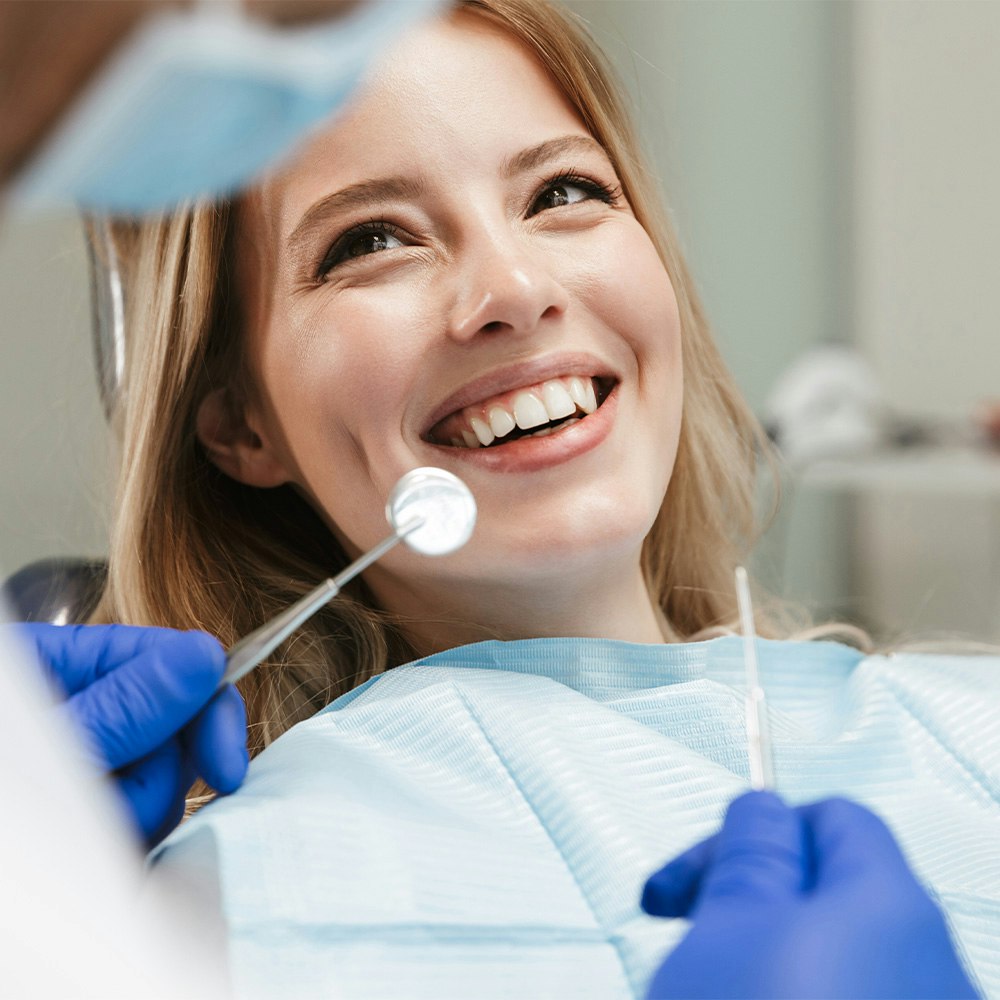 Smiling woman in a dental implants consultation