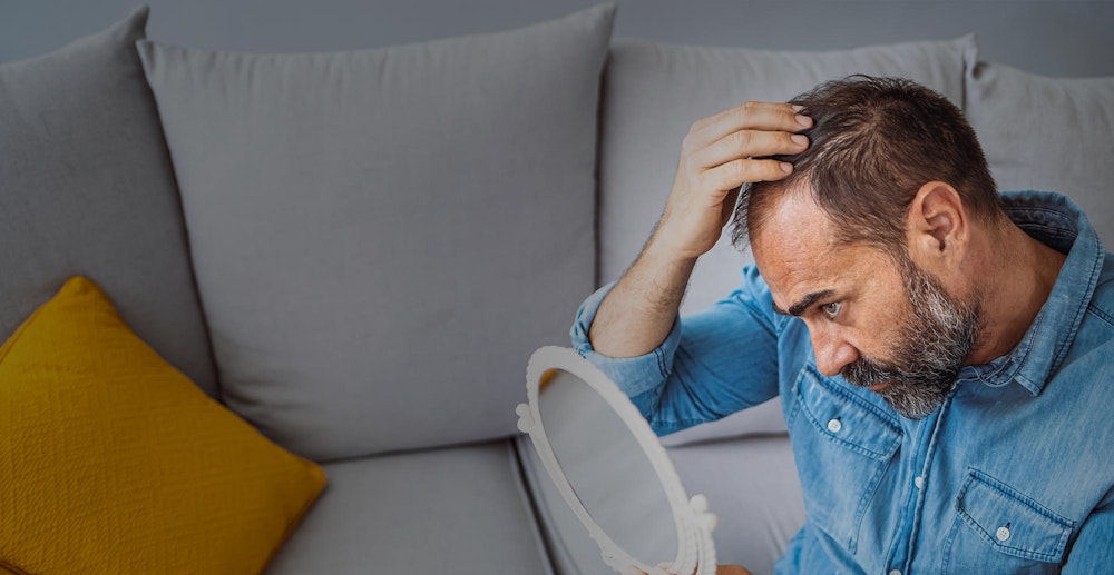 Man looking in the mirror