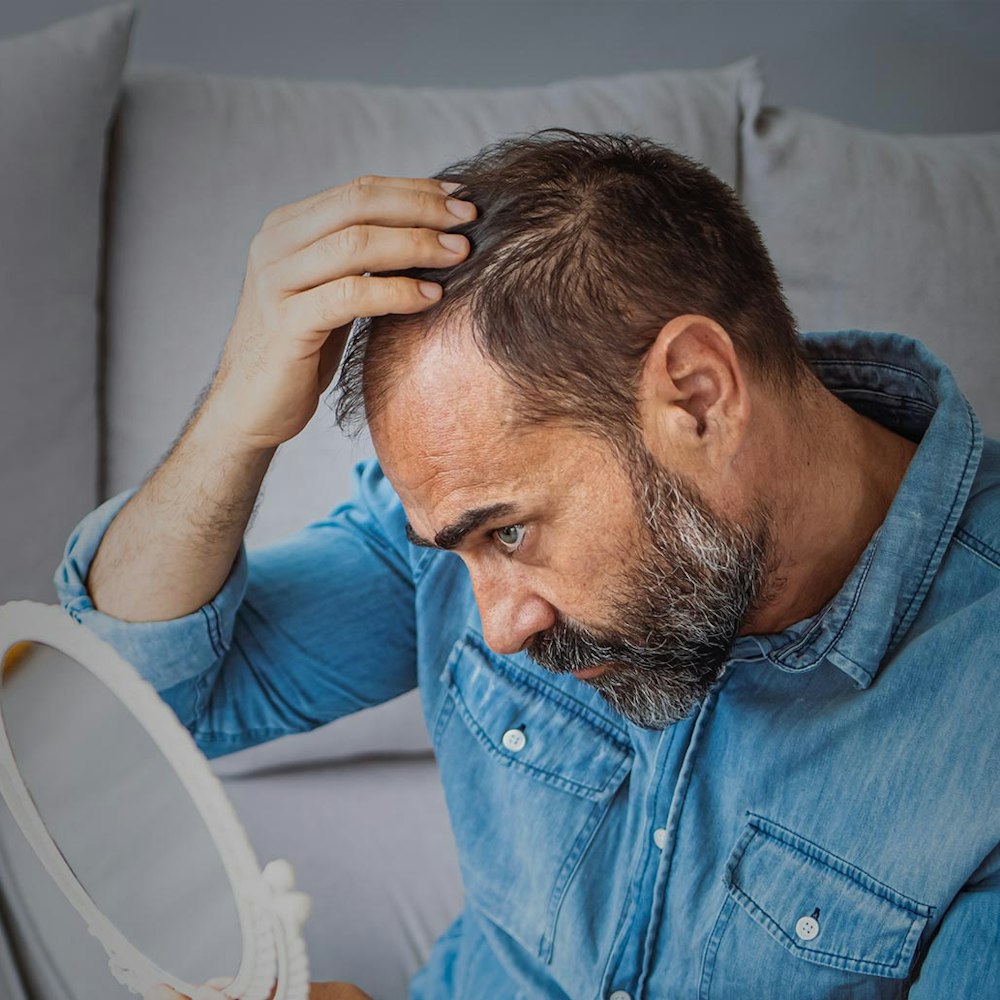 Man looking in the mirror