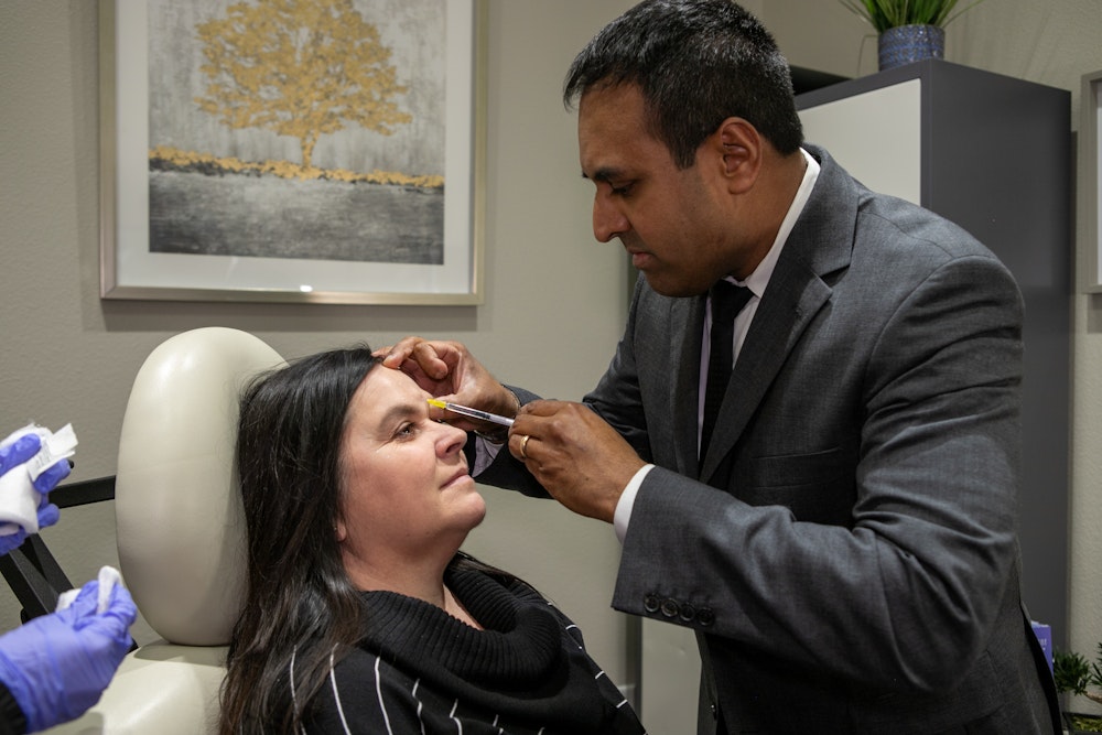 Dr. Rumalla performing an injectables treatment
