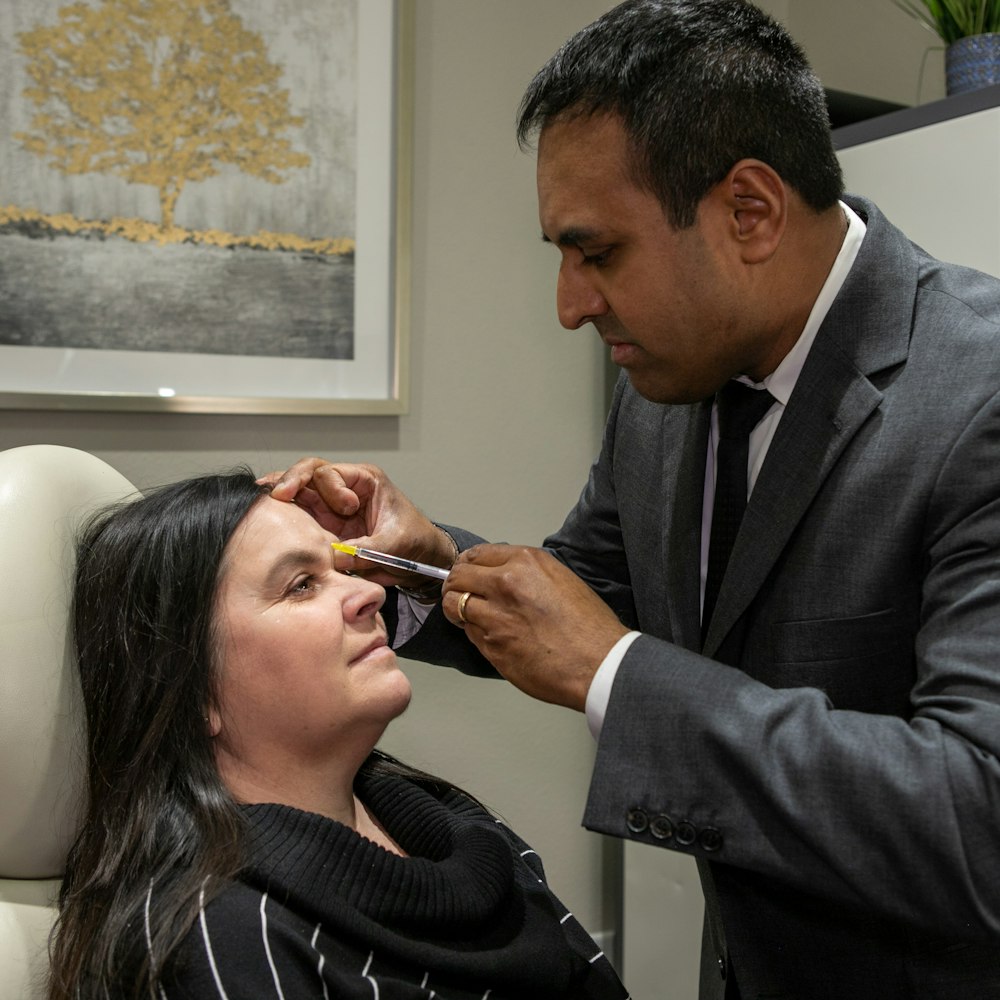 Dr. Rumalla performing an injectables treatment