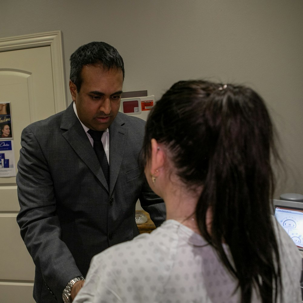 Dr. Rumalla in consultation with a patient