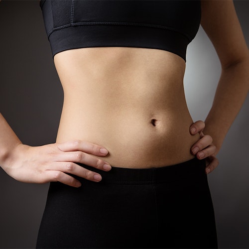 a woman with a flat stomach