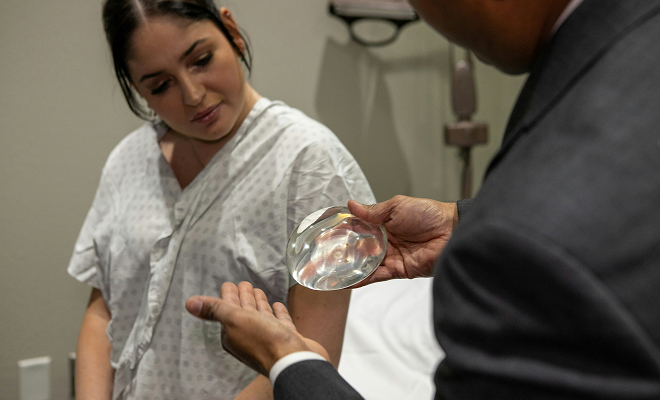 Dr. Rumalla with breast augmentation patient