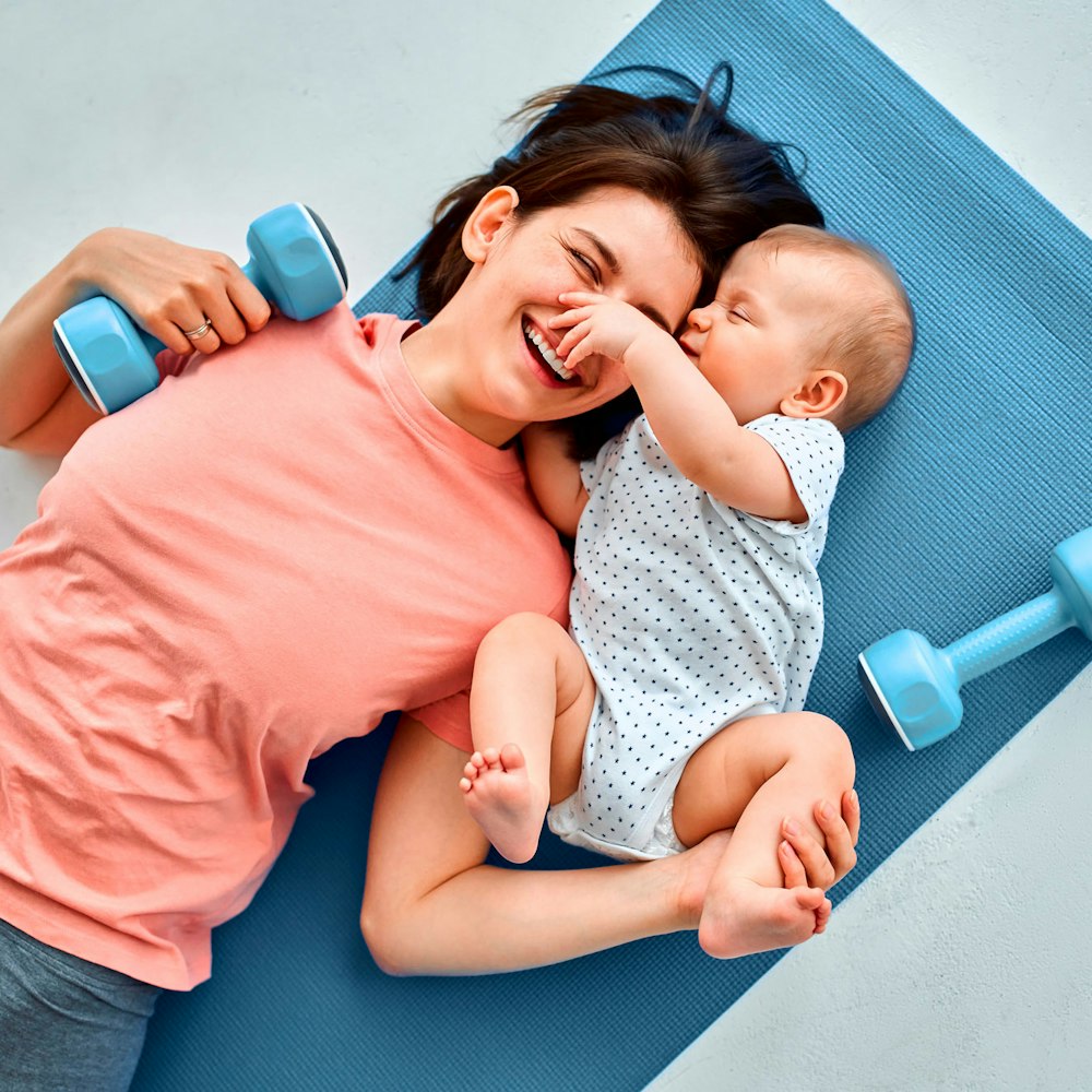 mom on yoga mat with baby