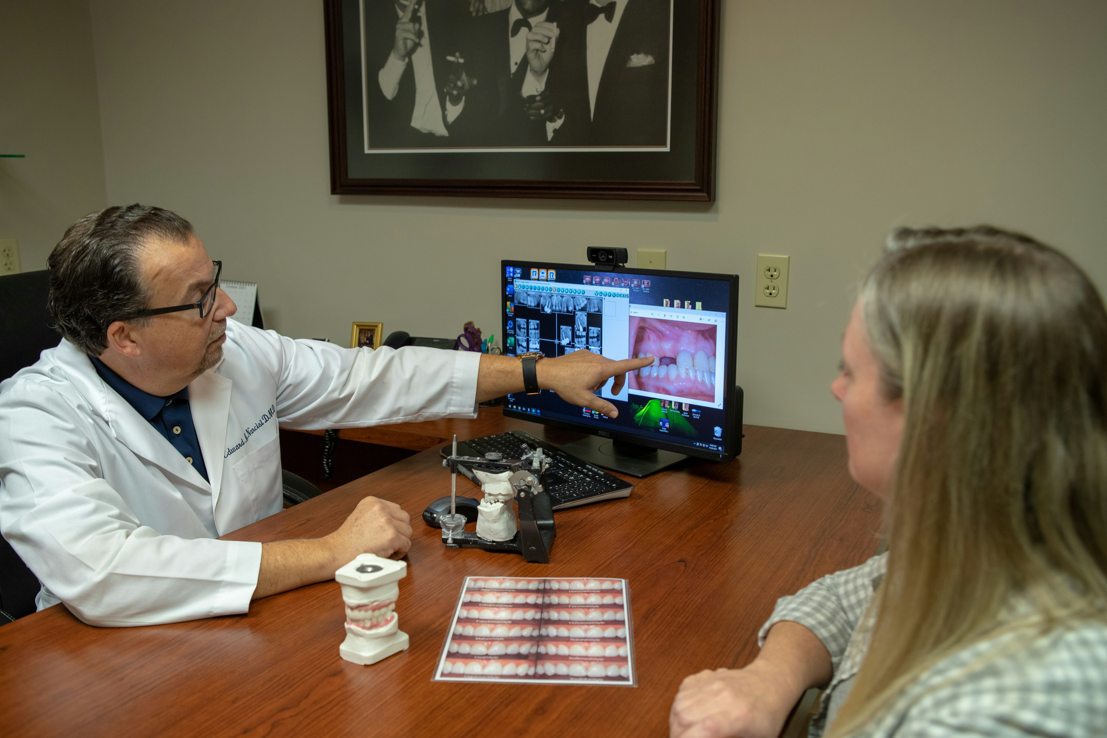 Dr. Narcisi and patient reviewing teeth