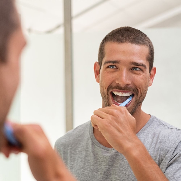 Man brushing teeth