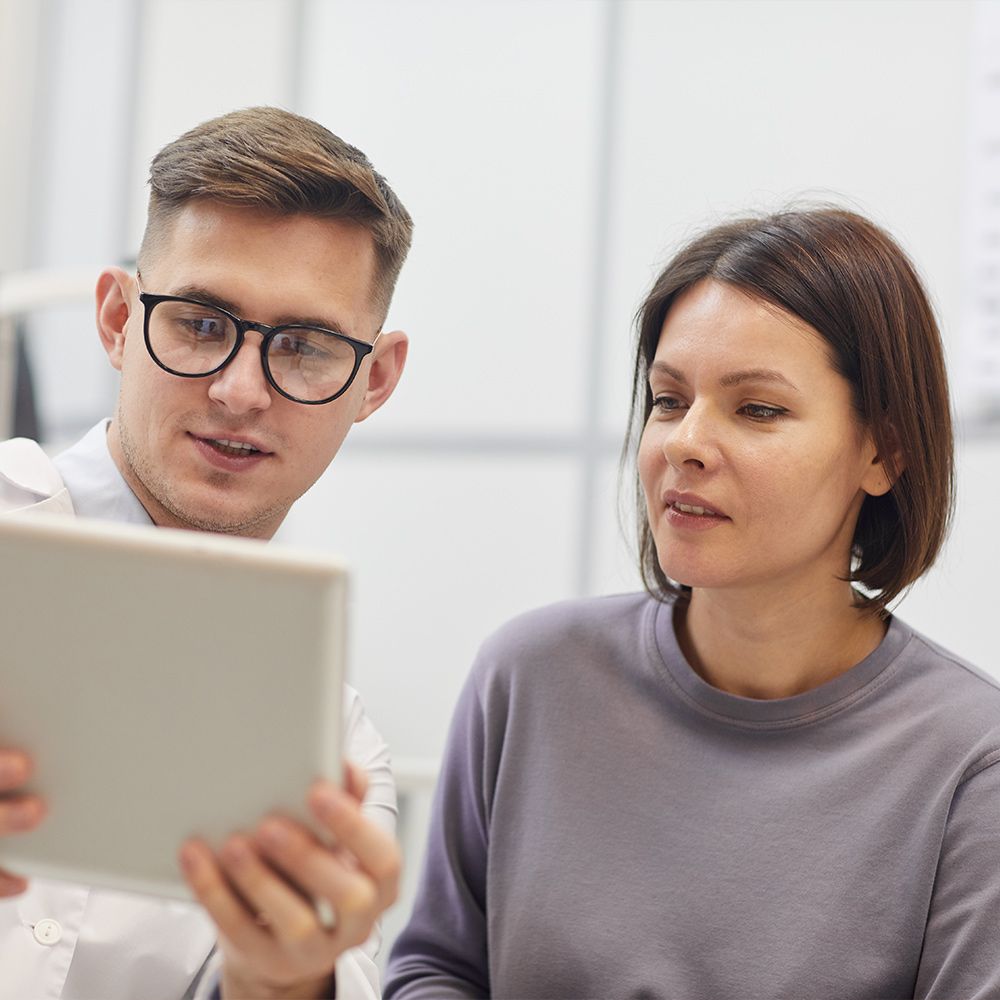 Two people looking at a computer