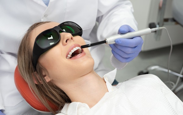woman receiving laser gum treatment