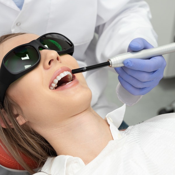 woman receiving laser gum treatment