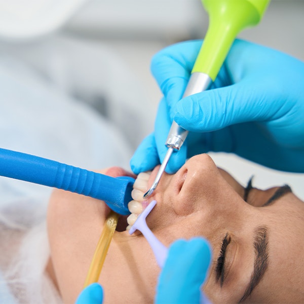 woman receiving dental ozone therapy